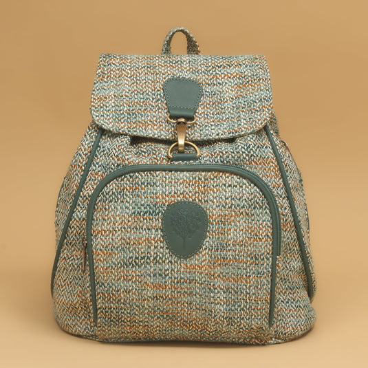 Handmade canvas backpack with recycled fabric and eco-leather accents in earthy tones