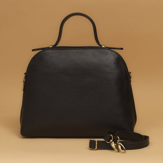 Black eco-leather crescent-shaped cross body bag with gold hardware and detachable strap