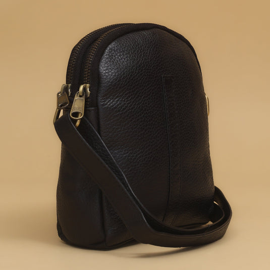 Black eco-leather crescent-shaped small cross body bag with dual zip compartments and adjustable strap