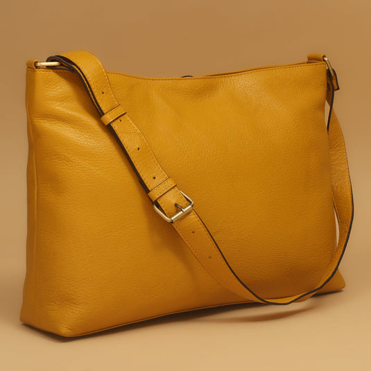 Mustard eco-leather hobo bag with adjustable strap and pebbled texture