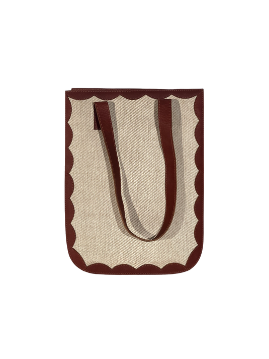 Handmade jute-cotton tote bag with scalloped edges.