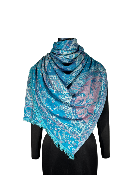 Woolen stole made from 100% merino wool, reversible with contemporary paisley jacquard design in blue.