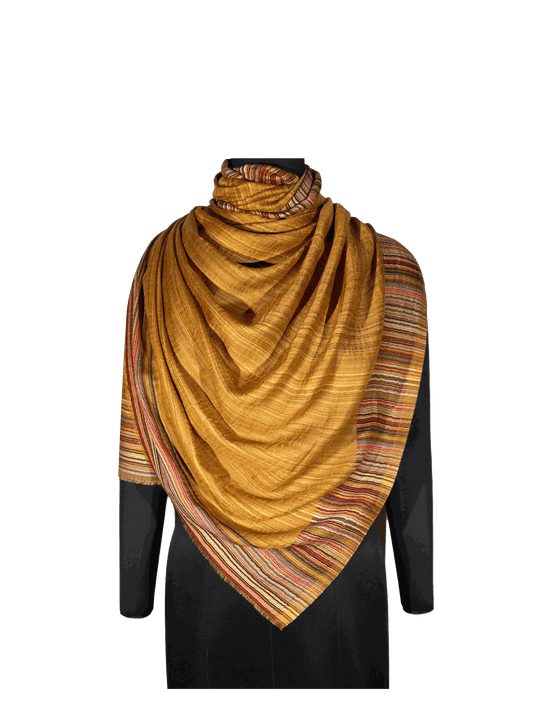 Woolen stole made of 100% merino wool with jacquard abstract stripes and solid design in a reversible style.